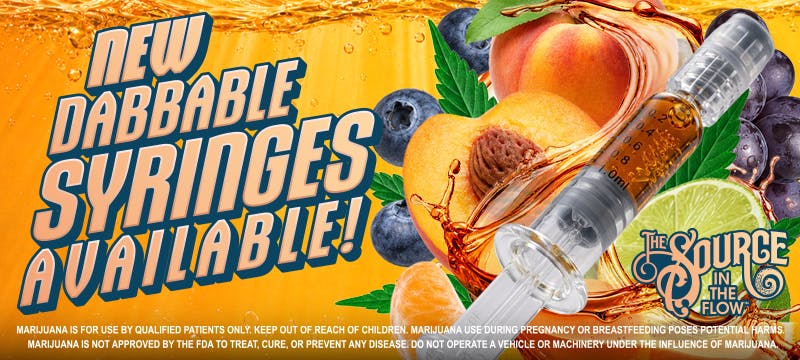 Announcement banner for The Source Apothecary's new In The Flow dabbable syringes, now available at The Source dispensary located in Rogers, Arkansas, featuring a THC dab syringe with peach, blueberry, and lime fruit imagery on a splashing orange background.