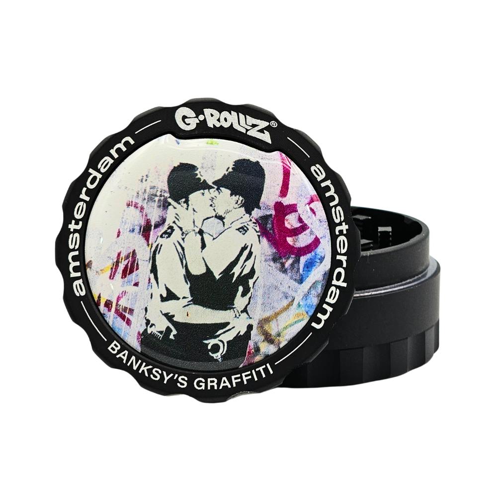 G-rollz - metal grinder - 53mm - 3pc - banksy graffiti 'kissing cops'