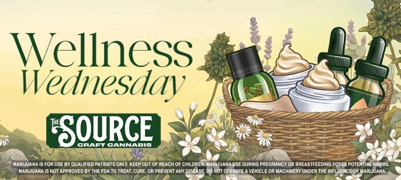 Wellness Wednesday promotional banner for The Source Craft Cannabis in Rogers, AR. Illustrated graphic featuring a wicker basket filled with cannabis topicals including tincture bottles and cream jars, surrounded by chamomile flowers, lavender, and botanical herbs against a soft yellow-green background.